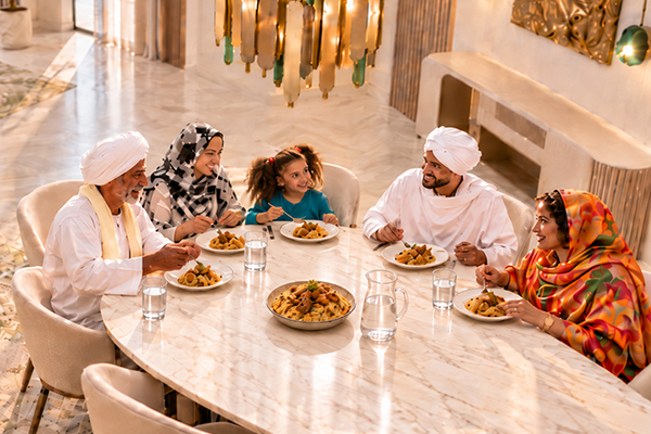 Sudan family sharing a meal